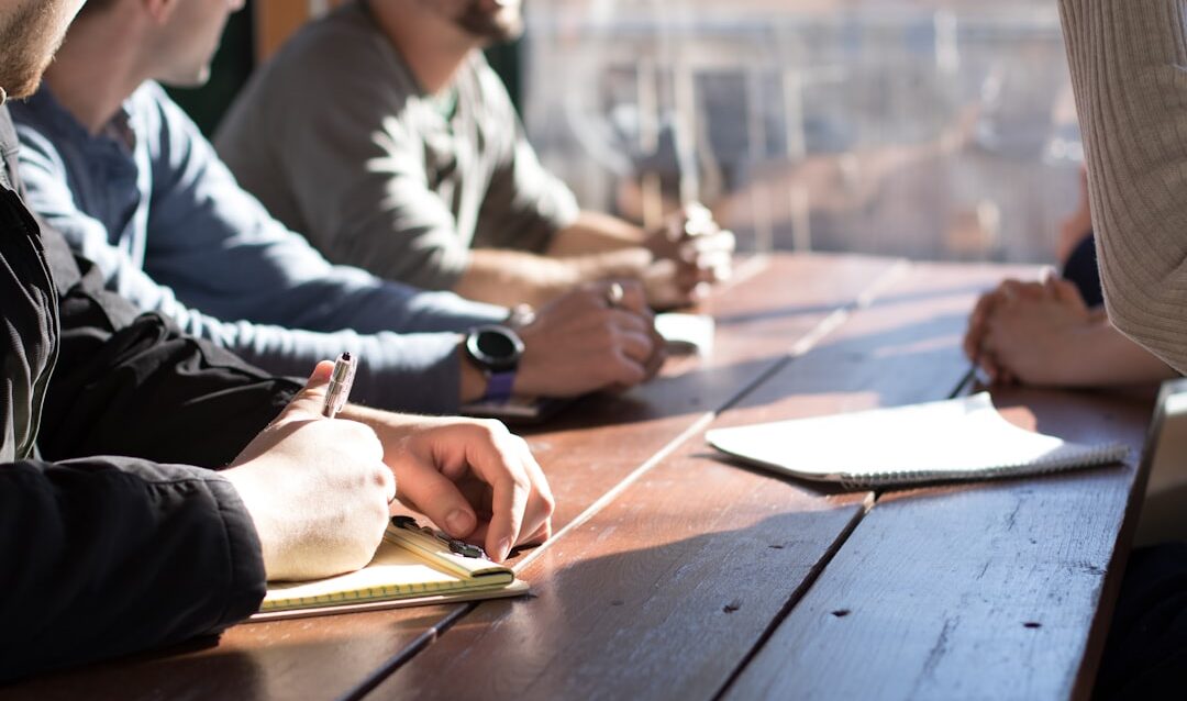 featured-27e0046dd8 people sitting on chair in front of table while holding pens during daytime