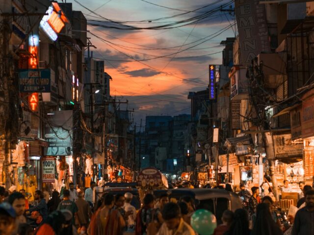 people walking on street during night time