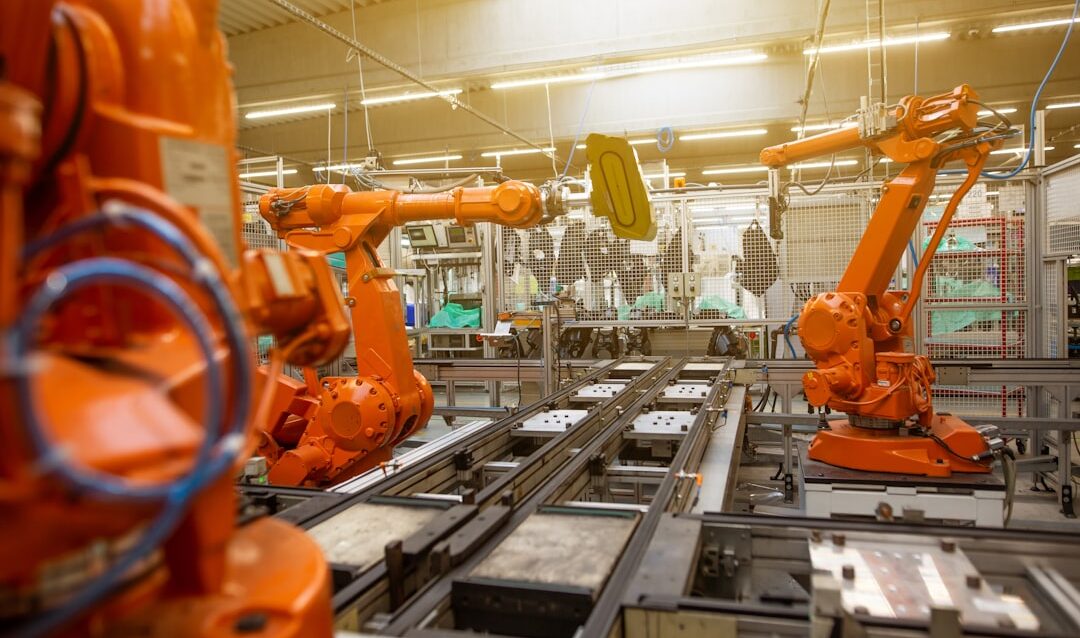 a factory filled with lots of orange machines