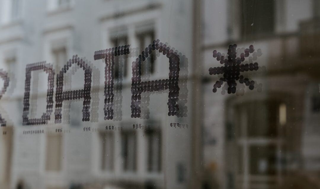 featured-654bf4dc97 The word DATA and a star symbol stenciled in dark dots on glass