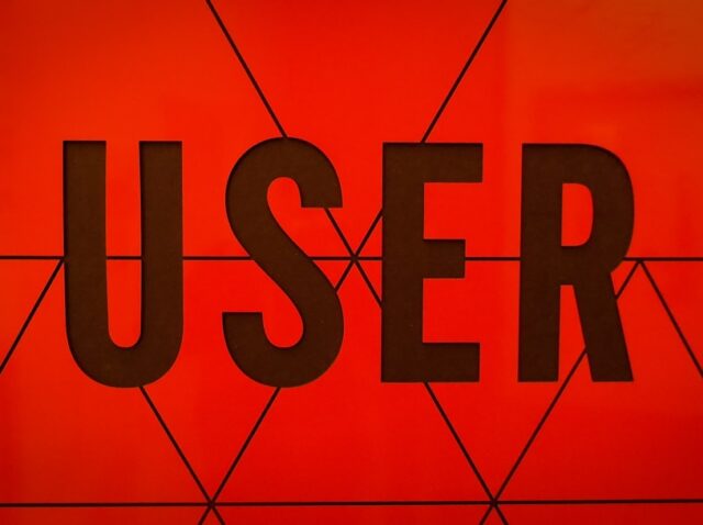 a close up of the word user on a wall
