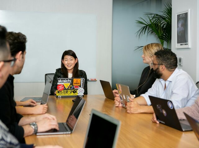 people in a meeting discussing app development