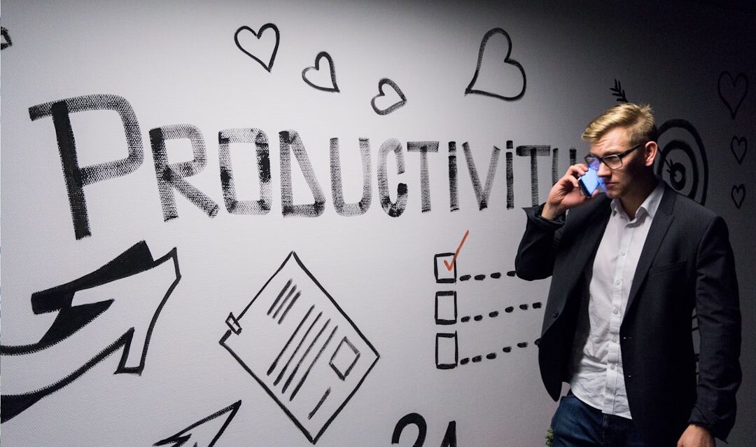 featured-f6f9fae95c man holding smartphone looking at productivity wall decor