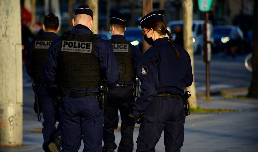 featured-bb6b1877d1 2 police men in police uniform standing on road during daytime